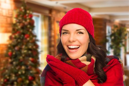 simsearch:400-06462603,k - Happy Mixed Race Woman Wearing Mittens and Hat In Christmas Setting. Stock Photo - Budget Royalty-Free & Subscription, Code: 400-08402501