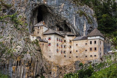 simsearch:400-05119652,k - Renaissance Castle Built Inside Rocky Mountain in Predjama, Slovenia. Famous Tourist Place in Europe. Stock Photo - Budget Royalty-Free & Subscription, Code: 400-08402579