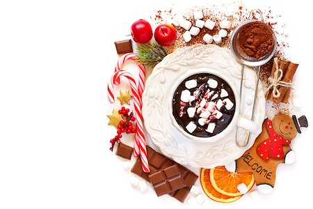 simsearch:400-08338402,k - Cup of creamy hot chocolate with marshmallows and candy cane drops surrounded food ingredients and some christmas decoration on white background with place for text. Foto de stock - Super Valor sin royalties y Suscripción, Código: 400-08402606