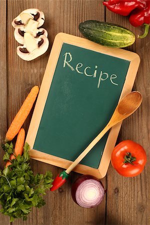 simsearch:400-09011310,k - Chalkboard and fresh organic vegetables Fotografie stock - Microstock e Abbonamento, Codice: 400-08402654