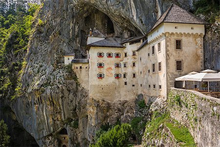 simsearch:400-05119652,k - Renaissance Castle Built Inside Rocky Mountain in Predjama, Slovenia. Famous Tourist Place in Europe. Stock Photo - Budget Royalty-Free & Subscription, Code: 400-08402751