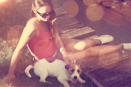 simsearch:400-08430017,k - Hipster Teenage Girl with her Dog Lying on the Grass. Toned and Filtered Photo with Bokeh. Modern Youth Lifestyle Concept. Stock Photo - Budget Royalty-Free & Subscription, Code: 400-08403554