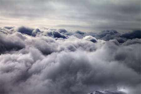 simsearch:400-08780271,k - Top of off-piste slope in storm clouds. Georgia, ski resort Gudauri. Caucasus Mountains. Photographie de stock - Aubaine LD & Abonnement, Code: 400-08403557