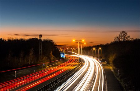 sunset ray - Car light trails on the M20 motorway in Kent, UK Photographie de stock - Aubaine LD & Abonnement, Code: 400-08403727