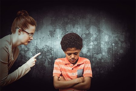 Female teacher shouting at boy against dark background Stock Photo - Budget Royalty-Free & Subscription, Code: 400-08414436