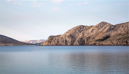 Sea lagoon enclosed by mountains early morning Stock Photo - Budget Royalty-Free & Subscription, Code: 400-08415306