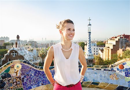 simsearch:400-08415527,k - Refreshing promenade in unique Park Guell style in Barcelona, Spain. Happy young woman tourist in Park Guell, Barcelona, Spain looking into the distance Stock Photo - Budget Royalty-Free & Subscription, Code: 400-08415518