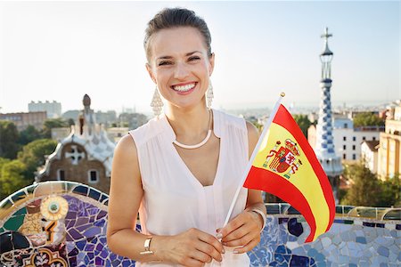 simsearch:400-08415527,k - Refreshing promenade in unique Park Guell style in Barcelona, Spain. Portrait of smiling young woman tourist with Spain flag in Park Guell, Barcelona, Spain Stock Photo - Budget Royalty-Free & Subscription, Code: 400-08415530