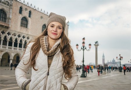 simsearch:400-08344334,k - Delightful Venice, Italy can help make the most of your next winter getaway. Portrait of happy young woman tourist on St. Mark's Square near Dogi Palace Stock Photo - Budget Royalty-Free & Subscription, Code: 400-08415679