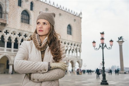 simsearch:400-08344334,k - Delightful Venice, Italy can help make the most of your next winter getaway. Portrait of young woman tourist standing on St. Mark's Square near Dogi Palace and looking into the distance Stock Photo - Budget Royalty-Free & Subscription, Code: 400-08415686