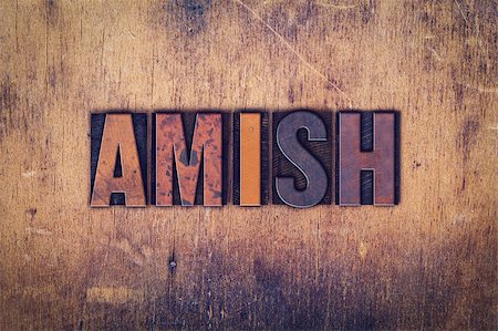 The word "Amish" written in dirty vintage letterpress type on a aged wooden background. Stock Photo - Budget Royalty-Free & Subscription, Code: 400-08410549