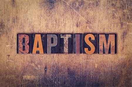 simsearch:400-07325569,k - The word "Baptism" written in dirty vintage letterpress type on a aged wooden background. Fotografie stock - Microstock e Abbonamento, Codice: 400-08410553