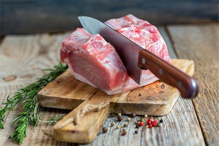 pork loin - Piece of pork loin, pepper and rosemary. Stock Photo - Budget Royalty-Free & Subscription, Code: 400-08410803