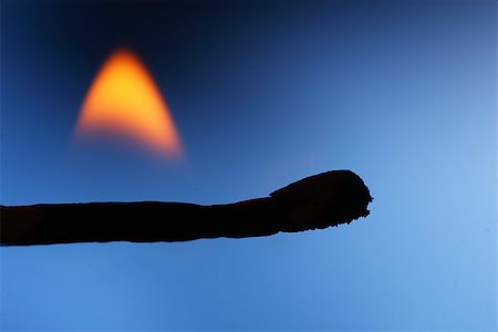 simsearch:400-05304869,k - Burning  matchstick on blue background close up Stock Photo - Budget Royalty-Free & Subscription, Code: 400-08410840