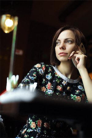 shmel (artist) - Young woman at cafe  talking on the mobile phone Stock Photo - Budget Royalty-Free & Subscription, Code: 400-08410947