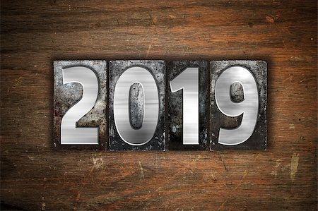 simsearch:400-08413731,k - The word "2019" written in vintage metal letterpress type on an aged wooden background. Stock Photo - Budget Royalty-Free & Subscription, Code: 400-08412060