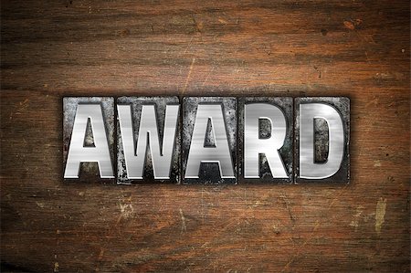 simsearch:400-08413731,k - The word "Award" written in vintage metal letterpress type on an aged wooden background. Stock Photo - Budget Royalty-Free & Subscription, Code: 400-08412102