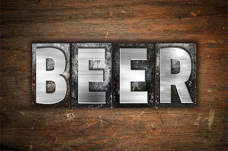 The word "Beer" written in vintage metal letterpress type on an aged wooden background. Stock Photo - Budget Royalty-Free & Subscription, Code: 400-08413041