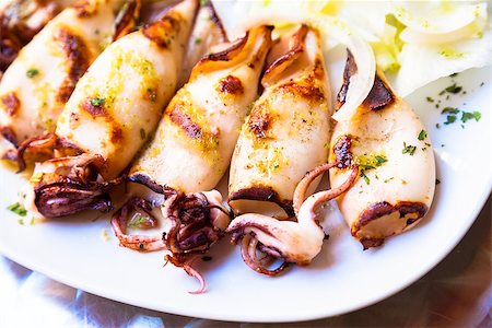 restaurants in tuscany italy - Fresh calamari served in an old Italian restaurant (Tuscany). Daylight. Stock Photo - Budget Royalty-Free & Subscription, Code: 400-08413195