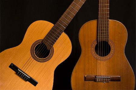 simsearch:400-08414976,k - approach two Spanish guitars on black background Stock Photo - Budget Royalty-Free & Subscription, Code: 400-08413794