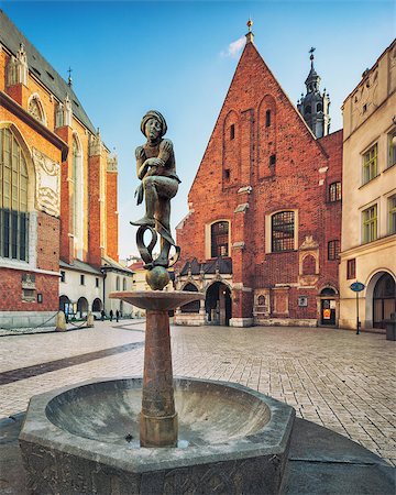 simsearch:400-05305595,k - Brass boy fountain sculpture on Mariacki Square Old Town of Krakow Poland Photographie de stock - Aubaine LD & Abonnement, Code: 400-08426991