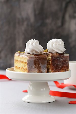 simsearch:400-04709493,k - portioned dessert piece of cake with cream and chocolate on a plate Stock Photo - Budget Royalty-Free & Subscription, Code: 400-08427099