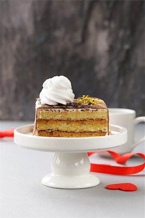 simsearch:400-04709493,k - portioned dessert piece of cake with cream and chocolate on a plate Stock Photo - Budget Royalty-Free & Subscription, Code: 400-08427100