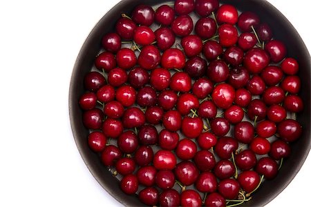 Red cherries in round baking tin, isolated on white background with copy-space for your text Stock Photo - Budget Royalty-Free & Subscription, Code: 400-08427501