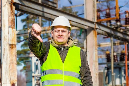 power station control - Disgruntled Electrical Engineer in the electric substation Stock Photo - Budget Royalty-Free & Subscription, Code: 400-08427747
