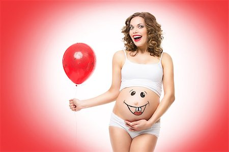 drawing girls body - Beautiful happy girl holding air balloon with smily funny face drawn on pregnant belly. Isolated. Foto de stock - Super Valor sin royalties y Suscripción, Código: 400-08427944