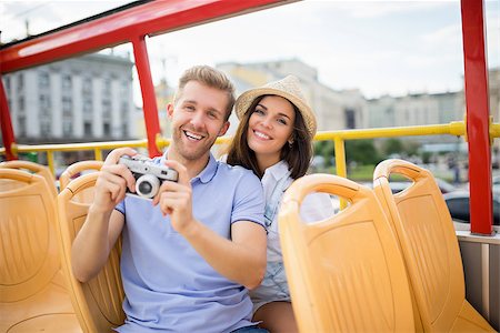 Smiling couple with rerto camera Stock Photo - Budget Royalty-Free & Subscription, Code: 400-08428144