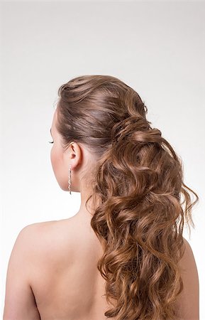 Beautiful long wavy hair on a gray background. Back view Photographie de stock - Aubaine LD & Abonnement, Code: 400-08428331