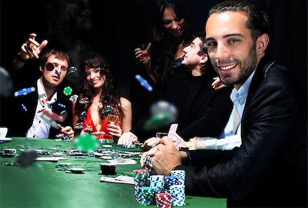 simsearch:400-06136085,k - young people are playing poker in a casino Fotografie stock - Microstock e Abbonamento, Codice: 400-08428553