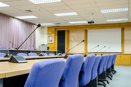 before a conference, the microphones in front of empty chairs in meeting room. Stock Photo - Budget Royalty-Free & Subscription, Code: 400-08428570