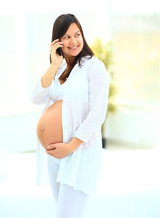 simsearch:400-08529613,k - woman holds her baby bump and looking up Stock Photo - Budget Royalty-Free & Subscription, Code: 400-08428788