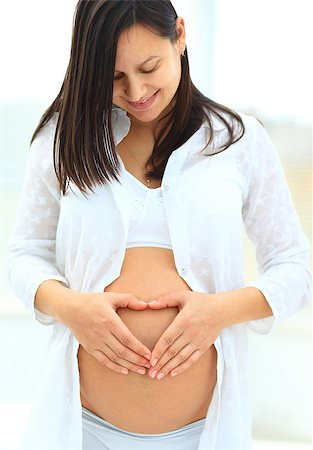 simsearch:400-08529613,k - woman holds her baby bump and looking up Stock Photo - Budget Royalty-Free & Subscription, Code: 400-08428789
