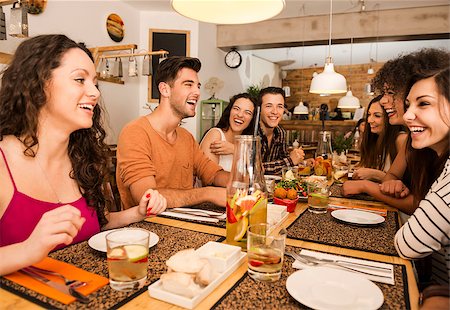 restaurant with young friends - Multi-Ethnic Group of happy friends lunching and having fun at the restaurant Stock Photo - Budget Royalty-Free & Subscription, Code: 400-08428852