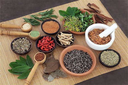 simsearch:400-06521200,k - Herb and spice selection used in herbal health for men on bamboo mat. Fotografie stock - Microstock e Abbonamento, Codice: 400-08429234
