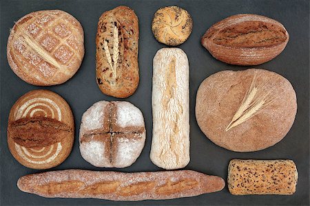 Rustic homemade bread selection on slate background. Stock Photo - Budget Royalty-Free & Subscription, Code: 400-08429232