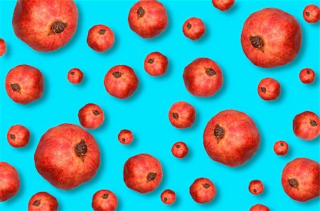 Red organic pomegranate on a light blue background Stockbilder - Microstock & Abonnement, Bildnummer: 400-08429251