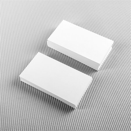 Photo of blank business cards with soft shadows on gray background. Template for ID. Top view. Stock Photo - Budget Royalty-Free & Subscription, Code: 400-08429349