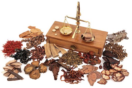 simsearch:400-06521200,k - Chinese herb ingredients used in traditional herbal medicine with old brass scales over white background. Fotografie stock - Microstock e Abbonamento, Codice: 400-08429430