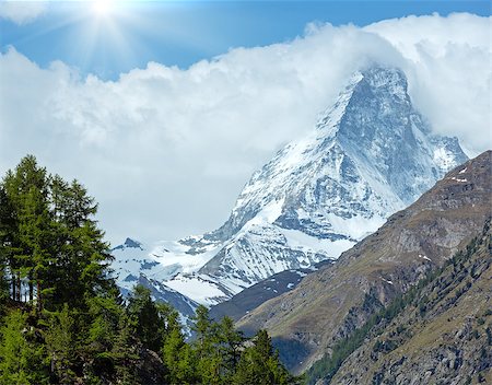simsearch:400-05344522,k - Summer Matterhorn mountain view and sunshine in blue sky (Alps, Switzerland, Zermatt) Photographie de stock - Aubaine LD & Abonnement, Code: 400-08429758