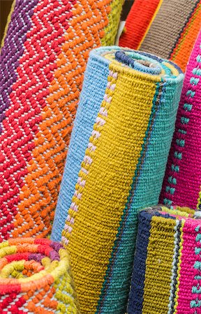 simsearch:841-02921059,k - Rolled up indian carpets in different colors Fotografie stock - Microstock e Abbonamento, Codice: 400-08430181
