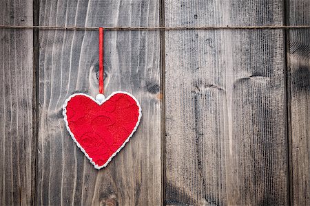 simsearch:400-08034173,k - Love concept. Heart hanging on a string, shot on wooden background Stockbilder - Microstock & Abonnement, Bildnummer: 400-08431056