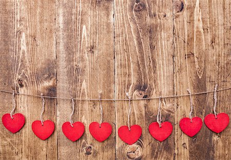 simsearch:400-08034173,k - Love concept. Hearts hanging on a string, shot on wooden background Stockbilder - Microstock & Abonnement, Bildnummer: 400-08431057