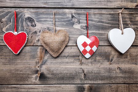 simsearch:400-08034173,k - Love concept. Hearts hanging on a string, shot on wooden background Stockbilder - Microstock & Abonnement, Bildnummer: 400-08431052