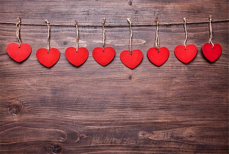 simsearch:400-08034173,k - Love concept. Hearts hanging on a string, shot on wooden background Stockbilder - Microstock & Abonnement, Bildnummer: 400-08431062