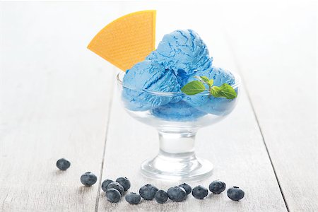 simsearch:400-08494395,k - Blue ice cream in glass with blueberry fruits on white rustic wooden background. Foto de stock - Super Valor sin royalties y Suscripción, Código: 400-08431195