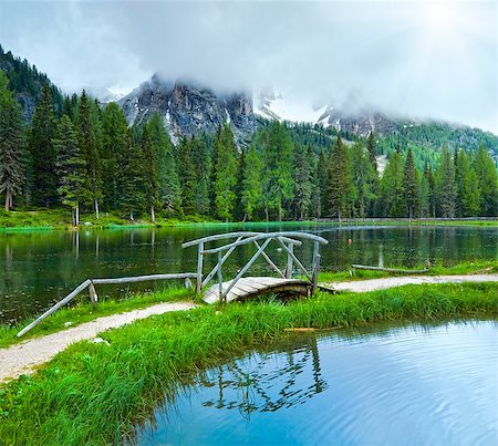 Beautiful summer Alpine  lake lago di Antorno view with sunshine through cloudy sky (Italia Dolomites) Stockbilder - Microstock & Abonnement, Bildnummer: 400-08431421